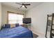 Cozy bedroom with a ceiling fan, bright window, and carpeted floors for a comfortable space at 1945 Bay Beauty Ln # 10, Austell, GA 30106