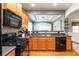 Open kitchen with stainless steel sink and a view into the living area at 1945 Bay Beauty Ln # 10, Austell, GA 30106