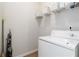 Functional laundry room featuring a washing machine, wire shelving and tile floors at 1945 Bay Beauty Ln # 10, Austell, GA 30106