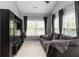 Bright living room with neutral colors, large windows and comfortable seating at 1945 Bay Beauty Ln # 10, Austell, GA 30106