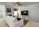 Bright living room featuring a fireplace, and an open floor plan with a large television set at 1945 Bay Beauty Ln # 10, Austell, GA 30106