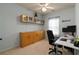 Well-lit home office with ample cabinet space, a computer, and a comfortable chair at 1945 Bay Beauty Ln # 10, Austell, GA 30106