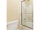 Close-up of a clean bathroom featuring a shower with glass door and white tiled walls at 28106 Plantation Ne Dr, Atlanta, GA 30324