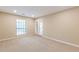 Bright bedroom featuring a window and balcony access at 28106 Plantation Ne Dr, Atlanta, GA 30324