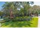 Well-manicured community entrance with brick pillars and colorful flower beds at 28106 Plantation Ne Dr, Atlanta, GA 30324