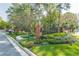 Well-manicured community entrance with brick pillars and colorful flower beds at 28106 Plantation Ne Dr, Atlanta, GA 30324
