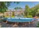 Exterior of the building with a water fountain and lush green landscaping at 28106 Plantation Ne Dr, Atlanta, GA 30324