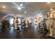 Spacious workout room featuring several machines, rubber flooring, and neutral walls at 28106 Plantation Ne Dr, Atlanta, GA 30324