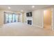 Bright living room with fireplace and balcony access at 28106 Plantation Ne Dr, Atlanta, GA 30324