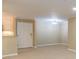 Living room view of kitchen breakfast bar and exterior door at 28106 Plantation Ne Dr, Atlanta, GA 30324