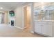 Cozy living room featuring a fireplace, a wet bar, and neutral carpeting at 28106 Plantation Ne Dr, Atlanta, GA 30324