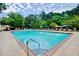 Inviting community pool with sparkling water and ample lounge seating at 28106 Plantation Ne Dr, Atlanta, GA 30324