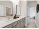 Modern bathroom features double sinks, neutral cabinets, and a sleek design for a luxurious feel at 3248 Shirecrest Ln, Dacula, GA 30019