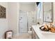 Contemporary bathroom with glass shower, dual sinks, and stylish decor at 3248 Shirecrest Ln, Dacula, GA 30019
