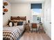 Bedroom with natural light, a wooden desk and a view of the surrounding neighborhood at 3248 Shirecrest Ln, Dacula, GA 30019