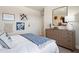 Comfortable bedroom with floral decor and natural light creates a serene and welcoming ambiance at 3248 Shirecrest Ln, Dacula, GA 30019