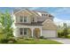 Charming two-story brick home with blue shutters, manicured landscaping, and an attached two-car garage at 3248 Shirecrest Ln, Dacula, GA 30019