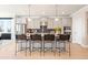 Bright kitchen featuring gray cabinetry, a central island with seating, and modern pendant lights at 3248 Shirecrest Ln, Dacula, GA 30019