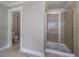 Bathroom featuring tiled walk-in shower and tiled flooring at 3460 Village Park Sw Ln, Atlanta, GA 30331