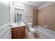 Bathroom with a single vanity, tub-shower combo, and neutral tile at 3460 Village Park Sw Ln, Atlanta, GA 30331