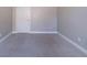 A cozy carpeted bedroom with gray walls provides a peaceful retreat at 3460 Village Park Sw Ln, Atlanta, GA 30331