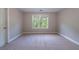 A bedroom with plush carpeting and large window that provides natural light at 3460 Village Park Sw Ln, Atlanta, GA 30331