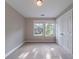 A bedroom with plush carpeting and double windows that provide natural light at 3460 Village Park Sw Ln, Atlanta, GA 30331