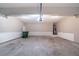 Spacious garage with sealed concrete floor and storage area at 3460 Village Park Sw Ln, Atlanta, GA 30331