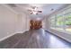 Bright living room featuring an open floor plan, wood-look flooring and large windows at 3460 Village Park Sw Ln, Atlanta, GA 30331