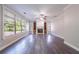Spacious living room featuring large windows, a fireplace, and built-in shelving at 3460 Village Park Sw Ln, Atlanta, GA 30331