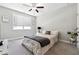 Cozy bedroom featuring a ceiling fan and plenty of natural light at 2410 Bridle Bridge Trl, Cumming, GA 30040