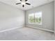 A bright and airy bedroom with a large window and plush carpeting at 2410 Bridle Bridge Trl, Cumming, GA 30040