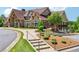Beautiful stone and siding clubhouse with architectural details, landscaped grounds, and inviting walkways at 2410 Bridle Bridge Trl, Cumming, GA 30040