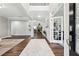 Grand foyer featuring hardwood floors, high ceilings, and an open view into the home's living spaces at 2410 Bridle Bridge Trl, Cumming, GA 30040
