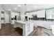 Modern kitchen with stainless steel appliances, granite countertops and a stylish backsplash at 2410 Bridle Bridge Trl, Cumming, GA 30040