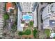 Top-down aerial view of the pool, outdoor amenities, and the building's design, set amidst lush greenery at 2520 Peachtree Nw Rd # 403, Atlanta, GA 30305