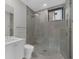 Bathroom with white vanity, glass shower, and neutral tile offering a clean and modern design at 2520 Peachtree Nw Rd # 403, Atlanta, GA 30305
