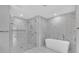 A luxurious bathroom displays a soaking tub and a glass-enclosed shower with marble tile, offering a spa-like experience at 2520 Peachtree Nw Rd # 403, Atlanta, GA 30305