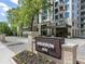 Luxury condo building, Graydon 2520, with elegant landscaping and brick entryway at 2520 Peachtree Nw Rd # 403, Atlanta, GA 30305