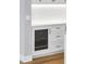Elegant kitchen with white cabinetry and a built-in wine fridge at 2520 Peachtree Nw Rd # 403, Atlanta, GA 30305