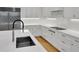 Bright kitchen with stainless steel appliances, white cabinets and countertops, and modern fixtures at 2520 Peachtree Nw Rd # 403, Atlanta, GA 30305