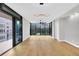 Spacious living area featuring hardwood floors and large windows for natural light at 2520 Peachtree Nw Rd # 403, Atlanta, GA 30305