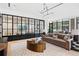 Cozy lounge area with a comfortable sofa, designer coffee table, and ample natural light at 2520 Peachtree Nw Rd # 403, Atlanta, GA 30305