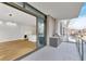 Open living area with chef's kitchen and access to outdoor patio featuring built in outdoor grill at 2520 Peachtree Nw Rd # 403, Atlanta, GA 30305