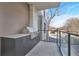 Outdoor kitchen features built-in grill and dining area perfect for entertaining friends and Gathering at 2520 Peachtree Nw Rd # 403, Atlanta, GA 30305