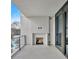 Private outdoor living space featuring a modern fireplace and pool view at 2520 Peachtree Nw Rd # 403, Atlanta, GA 30305