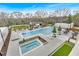 An aerial view of a luxurious pool area with lounge seating, a hot tub, and a dining area at 2520 Peachtree Nw Rd # 403, Atlanta, GA 30305