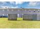 View of backyards with grassy lawns, fenced perimeters, and clear sky above the neighborhood at 2530 Marlin Dr, Mcdonough, GA 30253