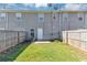 A quaint fenced backyard with a well-maintained lawn and a patio area at 2530 Marlin Dr, Mcdonough, GA 30253
