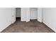 Bedroom featuring neutral carpet, closet and white trim at 2530 Marlin Dr, Mcdonough, GA 30253